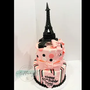 Paris themed- 8" (3 layer) &amp; 10" (3 layer) Smoothed buttercream cover. Fondant stripes/dots, bows.  Fondant and chocolate- Eiffel Tower