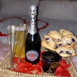 a bottle of champagne and a glass of wine