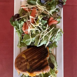 Half chicken pesto panini w/ a side salad.