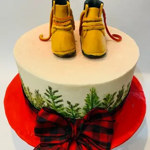 a pair of yellow shoes on top of a cake