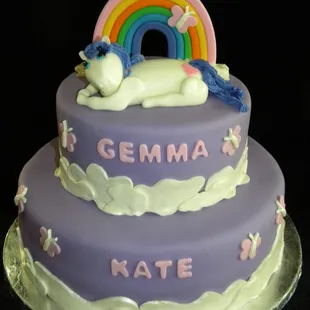 a cake with a unicorn and rainbow