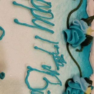 Crooked writing. Asked them to tell the decorator to use a color that'll pop. she came back with white. For a $53 cake I am disappointed