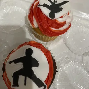 a cupcake with a silhouette of a man and a woman