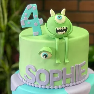 a cake with a monster on top