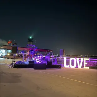 We had a stage for our live band and another plane on display. Such a cool view at night right off the runway.