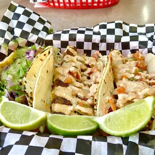 Left to Right (AL pastor, Blackened Fish Tacos)