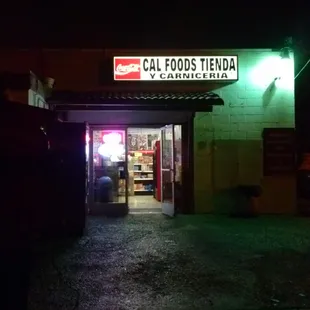the entrance to a restaurant at night