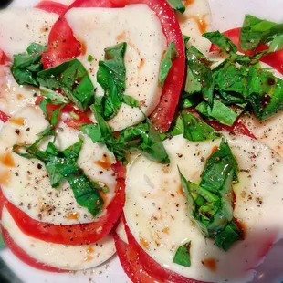 I made Caprese salad for our NY lunch. (Most) Ingredients from Cal-Mart. Tomatoes, fresh mozzarella cheese, fresh basil.