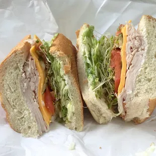 Turkey cheese sandwich with tomatoes and alfalfa sprouts