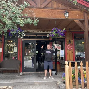 a man standing in front of the entrance