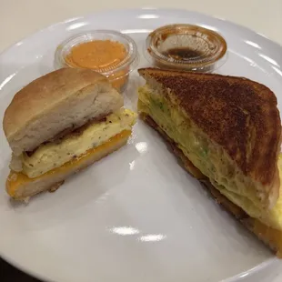 Cross section of biscuit and breakfast sandwich with pimento cheese and house hot sauce (not spicy, a little sweet)