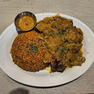 Yassa made with Chicken with Jollof Rice
