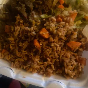 Curry goat rice and peas and cabbage