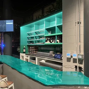 a bar with a green counter top