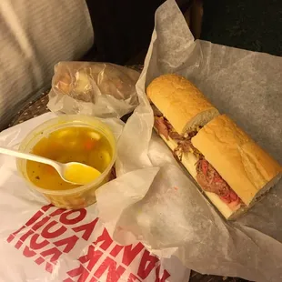 Roast beef with provolone, small cup of chicken noodle soup and their house chips.