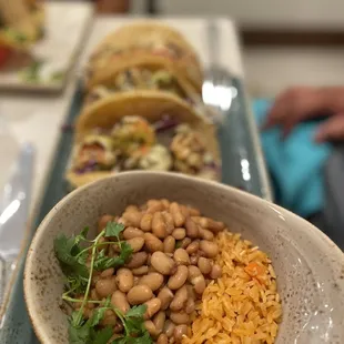 Shrimp tacos with bean and rice Auguachille  Elote