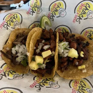 Bistec taco (to the left) and al pastor tacos