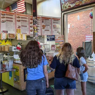 three women standing in front of a counter