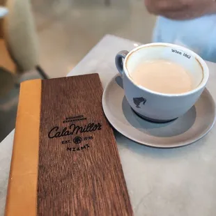 a cup of coffee and a menu