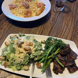 Steak tops, broccolini, caesar salad  Shrimp mac n cheese