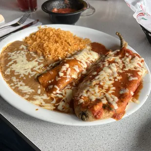 Chicken Enchilada, stuffed pepper (cheese and spinach), rice and refried beans.