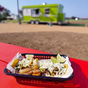 a plate of food on a red table