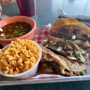 Birria tacos with consommé and rice