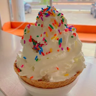 Waffle bowl sundae with whipped cream and sprinkles. Wow!