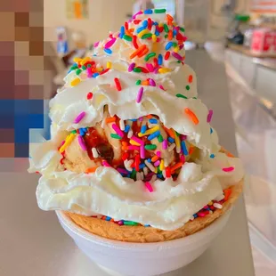 Waffle bowl sundae with whipped cream and sprinkles. Wow!