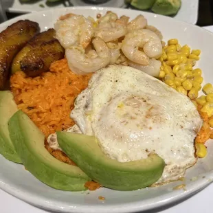 Camarones Al AJillo Cali bowl with a side of avocado.