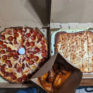 Large pepperoni pizza with extra cheese, cheesy bread, mango habanero chicken wings
