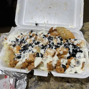 Chicken nachos w/black beans and sour cream!