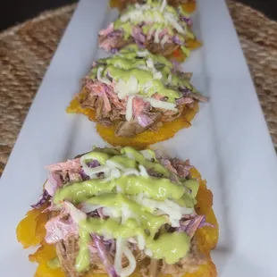 TOSTONES
Caribbean Venezuelan Treat
Twice-fried plantain slices whit toppings