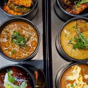 Left (Top-Bottom) Achari Paneer Amristari Chole Cali Sticky Ribs  Right (Top-Bottom) Smokey Chicken Wings Lamb Korma Dal Houzie