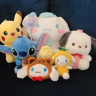 Everything we won. We traded 3 small plush/keychains for the big Cinnamoroll.