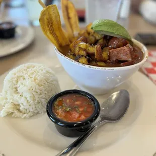 Delicious Cazuela con Frijoles. Rice, beans, pork belly, sausage, plantain chips with rice.