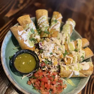 Taquitos with pico, crema and street corn! Amazing