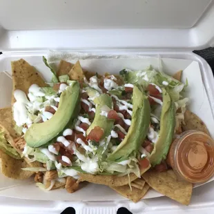 Chicken nachos with added avocado