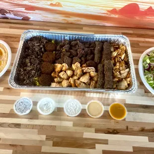 Our Family Platters bring together succulent kabobs, tantalizing shawarma, and a medley of savory sides, perfect for sharing