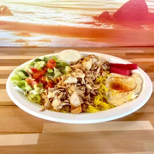 Juicy chicken shawarma slices, bursting with flavor and served with a side of our signature accompaniments, promise a satisfying meal