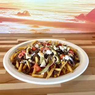 Indulge in a flavorful explosion with our Loaded Beef Shawarma Fries, a delicious marriage of seasoned beef and golden, crispy fries.