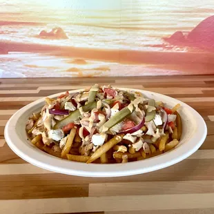 A symphony of flavors atop a bed of crispy fries, our Loaded Chicken Shawarma Fries are a savory delight for your taste buds.