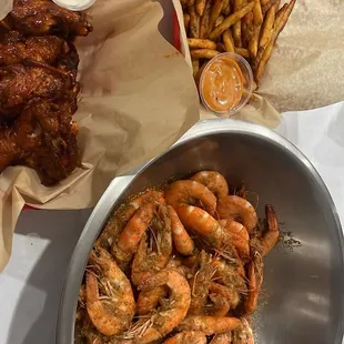 Shrimp, buffalo wings, and Cajun fries