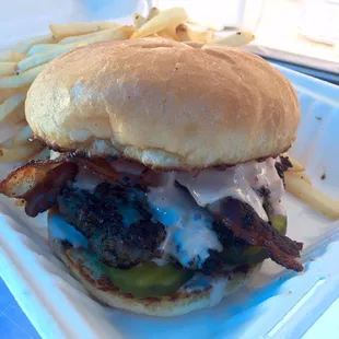 Diner Burger - 1/2 lb patty (ground chuck, brisket &amp; short ribs), sharp cheddar, bacon, pickle &amp; truck made Russian dressing on toasted bun.