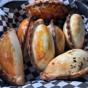 Beef and chicken spicy salteñas.