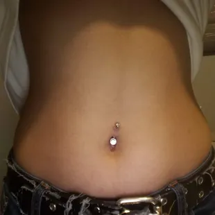 Crooked bellybutton piercing