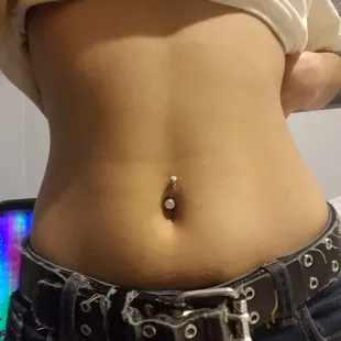 Crooked bellybutton piercing
