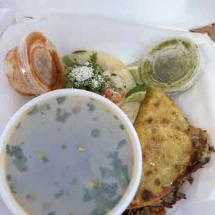 a bowl of soup and a sandwich