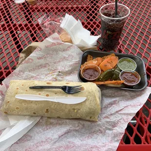 The Angel Burrito  knife and fork to help show size.  Salsas, and zanahorias y jalapeños en escabeche caseros.  The Angel Burrito