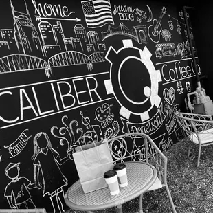 a black and white photo of a cafe